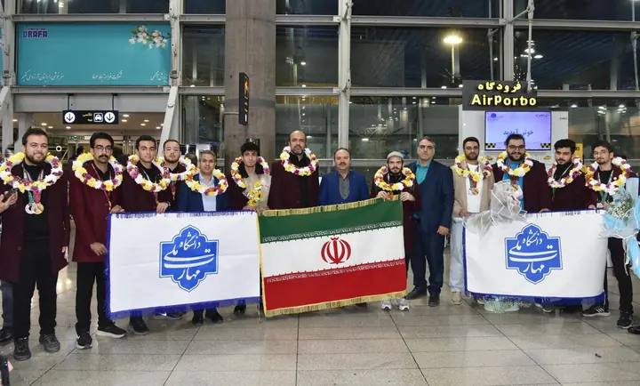 Welcome ceremony for the BRICS Hi-Tech 2025 Iran national team at the airport with the Iranian flag and the Ministry of Science flag